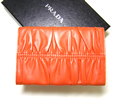Prada nappa bow occasion wallet, orange